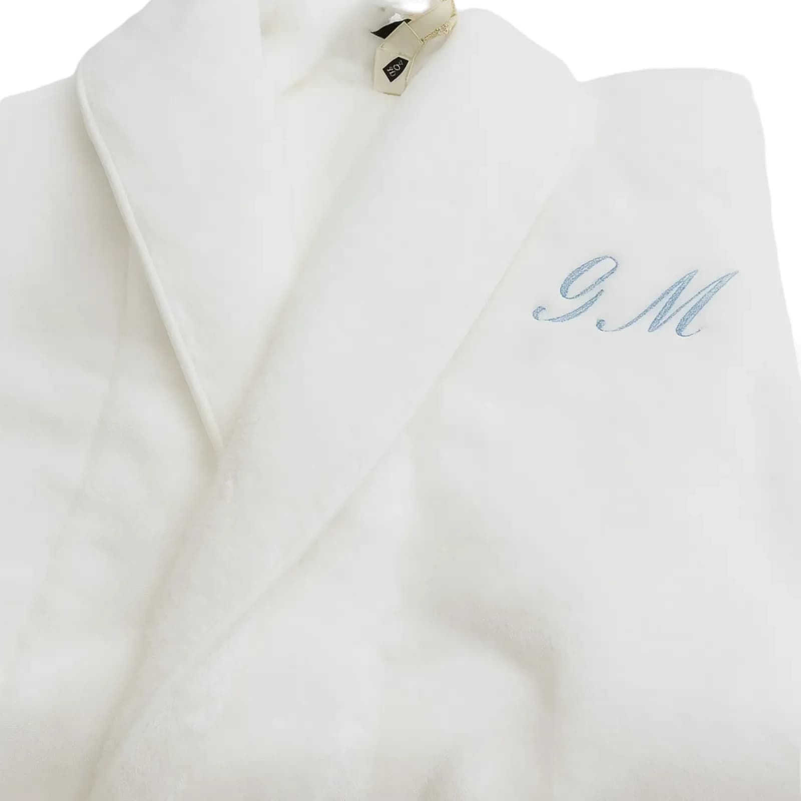 Broderie personnalisée sur peignoir : initiales G.M en fil bleu ciel
